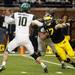 Michigan safety Charlie Zeller attempts to tackle Michigan State quarterback Andrew Maxwell on Saturday. Daniel Brenner I AnnArbor.com